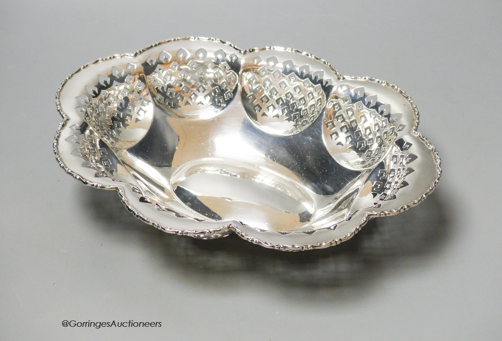 A George V lobed pierced silver oval bowl, Birmingham, 1928, 28.8cm, 12oz.